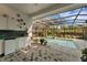 Pool area with kitchen and patio at 2850 Deer Run, Tarpon Springs, FL 34688