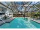 Inviting screened pool with spa and patio area at 2850 Deer Run, Tarpon Springs, FL 34688