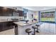 Dark wood cabinetry, granite countertops, and stainless steel appliances at 32591 Turtle Grace Loop, Wesley Chapel, FL 33545