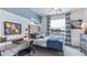 Bright bedroom with lake view, built-in desk, and comfy bed at 32603 Turtle Grace Loop, Wesley Chapel, FL 33545