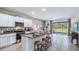 Modern kitchen with island, granite countertops, and stainless steel appliances at 32603 Turtle Grace Loop, Wesley Chapel, FL 33545