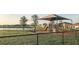 Community playground with shaded area near the lake at 32603 Turtle Grace Loop, Wesley Chapel, FL 33545