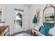 Bright and airy entryway with bench seating and storage at 32607 Turtle Grace Loop, Wesley Chapel, FL 33545