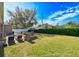 Backyard with patio, fire pit, and grassy area at 3407 Walden Reserve Dr, Plant City, FL 33566