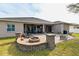 Expansive backyard oasis with a fire pit and brick patio at 3407 Walden Reserve Dr, Plant City, FL 33566