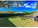 Landscaped backyard with grassy area and patio seating at 3407 Walden Reserve Dr, Plant City, FL 33566