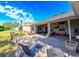 Spacious backyard patio with fire pit, seating area, and ample space for entertaining at 3407 Walden Reserve Dr, Plant City, FL 33566