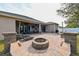 Large backyard with patio, fire pit, and plenty of space for entertaining at 3407 Walden Reserve Dr, Plant City, FL 33566