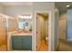 Bathroom with a shower, toilet, and teal vanity at 3407 Walden Reserve Dr, Plant City, FL 33566