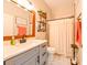 Modern bathroom with gray vanity, white tile, and a shower at 3407 Walden Reserve Dr, Plant City, FL 33566