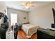 Cozy bedroom featuring a bed, window with shutters, and a workspace at 3407 Walden Reserve Dr, Plant City, FL 33566