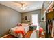 Bright bedroom with a comfy bed, ceiling fan, and wood flooring at 3407 Walden Reserve Dr, Plant City, FL 33566