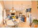 Bright dining room with a round table, black and white checkered runner, and view of the kitchen at 3407 Walden Reserve Dr, Plant City, FL 33566