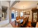 Spacious dining room with hardwood floors and large table, next to the entryway at 3407 Walden Reserve Dr, Plant City, FL 33566