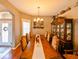 Elegant dining room featuring a large table, hutch, and hardwood floors at 3407 Walden Reserve Dr, Plant City, FL 33566
