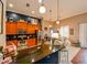 Open kitchen with an island, wood cabinets, granite countertops, and stainless steel appliances at 3407 Walden Reserve Dr, Plant City, FL 33566