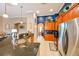 Kitchen boasts stainless steel appliances, ample cabinetry, and a granite countertop breakfast bar at 3407 Walden Reserve Dr, Plant City, FL 33566