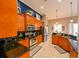 Bright kitchen with wood cabinets, granite countertops, and stainless steel appliances at 3407 Walden Reserve Dr, Plant City, FL 33566