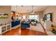 Open-concept living room and kitchen with hardwood floors and comfortable seating at 3407 Walden Reserve Dr, Plant City, FL 33566