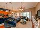 Spacious living room features a sectional sofa, coffee table, and an open floor plan to the kitchen at 3407 Walden Reserve Dr, Plant City, FL 33566