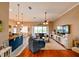 Spacious living room with hardwood floors, sectional sofa, and open concept kitchen view at 3407 Walden Reserve Dr, Plant City, FL 33566