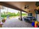 Spacious covered patio with seating, dining area, and fire pit at 3407 Walden Reserve Dr, Plant City, FL 33566