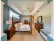 Bright Primary bedroom with a king-size bed and wooden furniture at 3407 Walden Reserve Dr, Plant City, FL 33566