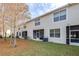 View of the back of the townhome and the backyard at 3529 High Hampton Cir, Tampa, FL 33610