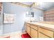 Bathroom with light wood vanity and patterned shower curtain at 3529 High Hampton Cir, Tampa, FL 33610