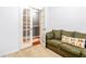 Cozy bonus room features a comfy sofa and access to an upper loft at 3529 High Hampton Cir, Tampa, FL 33610