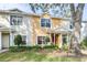Two-story townhome with landscaping and a tree at 3529 High Hampton Cir, Tampa, FL 33610