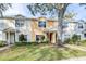 Two-story townhome with a tree and walkway at 3529 High Hampton Cir, Tampa, FL 33610