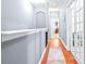 Upper hallway with wood floors and access to bedrooms at 3529 High Hampton Cir, Tampa, FL 33610