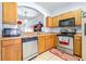 Kitchen with stainless steel appliances and wood cabinets at 3529 High Hampton Cir, Tampa, FL 33610