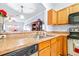 Kitchen features a double sink and wood cabinets at 3529 High Hampton Cir, Tampa, FL 33610