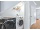 Laundry room with washer and dryer and overhead shelving at 3529 High Hampton Cir, Tampa, FL 33610