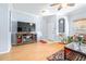 Living room with flat screen TV and hardwood floors at 3529 High Hampton Cir, Tampa, FL 33610