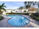 Community pool with brick patio and lounge chairs at 3529 High Hampton Cir, Tampa, FL 33610