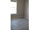 Simple bedroom with gray walls and wood-look floors at 3722 Spinnaker Dr, Tampa, FL 33611