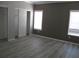 Spacious bedroom with two closets and wood-look flooring at 3722 Spinnaker Dr, Tampa, FL 33611