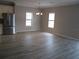 Spacious dining area with gray walls and wood-look floors at 3722 Spinnaker Dr, Tampa, FL 33611