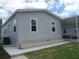 Gray mobile home with stone base and landscaping at 3722 Spinnaker Dr, Tampa, FL 33611