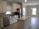 Modern kitchen featuring stainless steel appliances and an island at 3722 Spinnaker Dr, Tampa, FL 33611