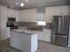 Modern kitchen with white cabinets and stainless steel appliances at 3722 Spinnaker Dr, Tampa, FL 33611