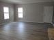 Living room with gray walls and wood-look floors at 3722 Spinnaker Dr, Tampa, FL 33611
