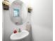 Small bathroom with pedestal sink and an oval mirror at 3830 Vignoble Ln, Brandon, FL 33511