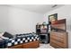 Bedroom with desk, TV, and bed at 3830 Vignoble Ln, Brandon, FL 33511