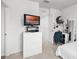 Bright bedroom with built-in desk and TV at 3830 Vignoble Ln, Brandon, FL 33511