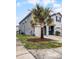 Side view of gray two-story townhome with palm trees at 3830 Vignoble Ln, Brandon, FL 33511