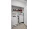 Laundry closet with washer, dryer, and overhead storage at 3830 Vignoble Ln, Brandon, FL 33511